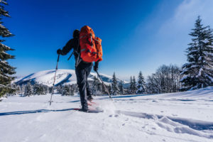 Photo of a Solo Man Snowshoeing in Vermont's Upper Valley.
