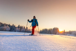 Photo of a Man Snowshoeing in Vermont During Winter.