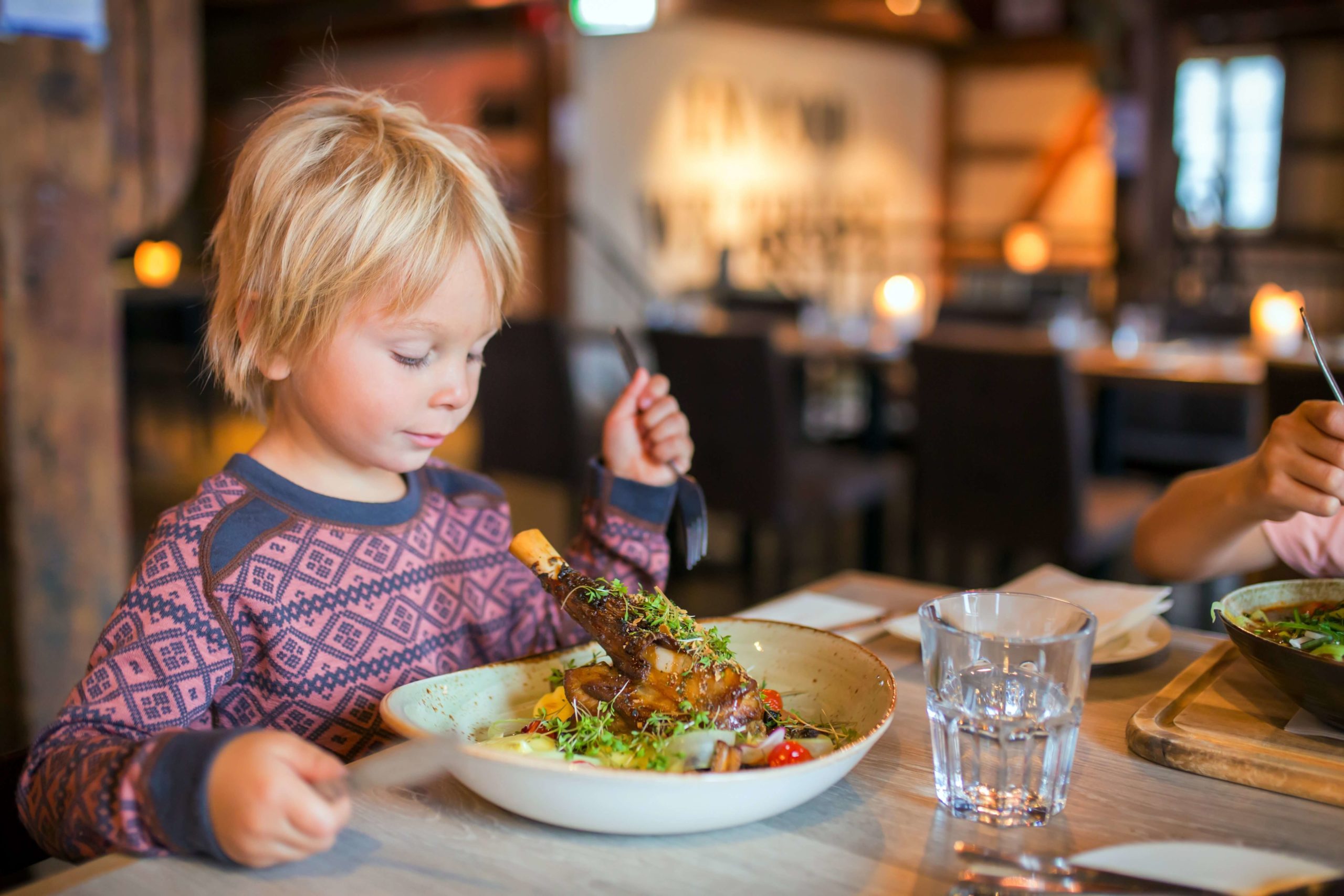 A child boy eating at one of the best Norwich, VT, restaurants.