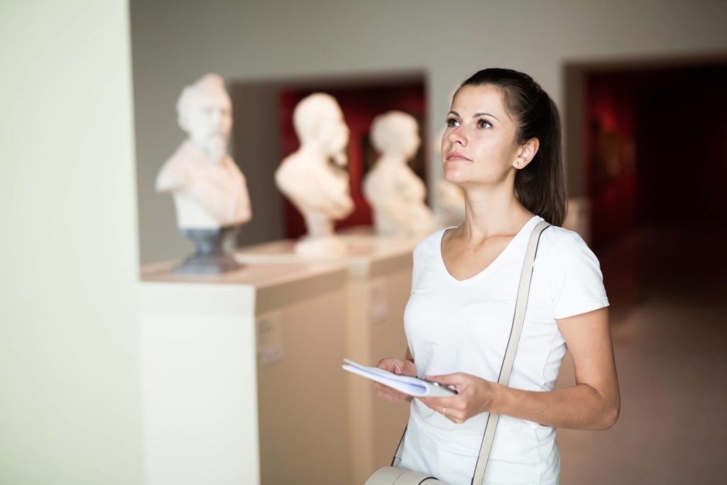 A woman on a tour in one of the many museums in Vermont.