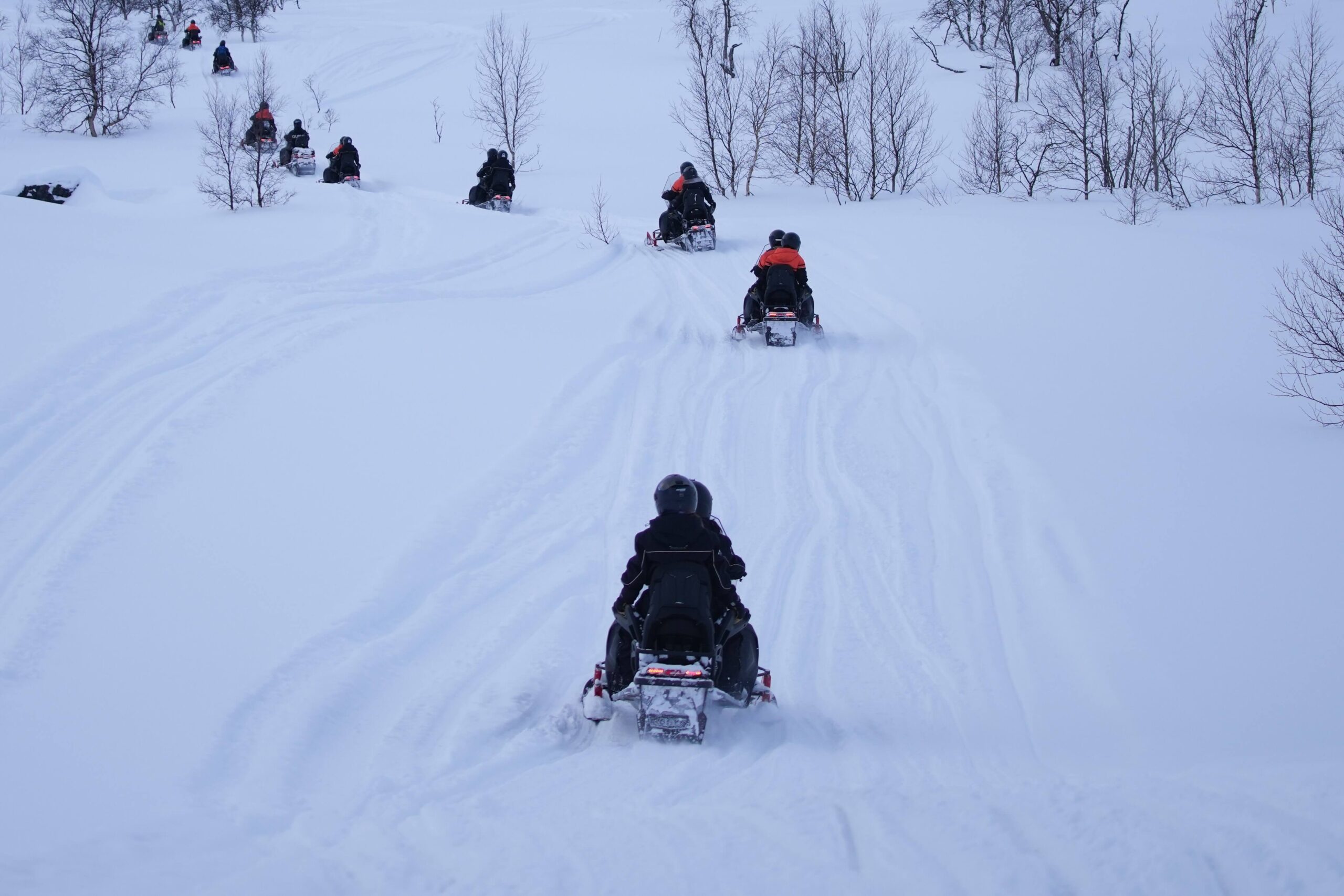 People on a Vermont Snowmobile tour.